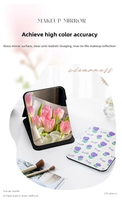 Close-up of portable makeup mirror featuring purple tulip pattern and sleek glass surface