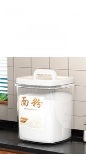 Close-up of airtight flour storage container with handle on modern kitchen counter