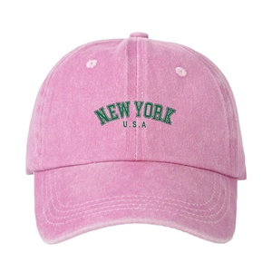 Pink washed cotton baseball cap featuring green NEW YORK USA embroidery and curved brim