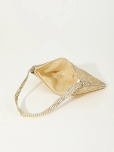 Top view of champagne rhinestone evening bag showing interior lining and zipper closure