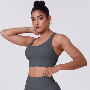 Detail of high-stretch seamless sports bra and high-waist yoga pants in dark grey