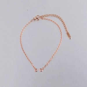 Close-up of rose gold 2mm stainless steel cable chain bracelet with lobster clasp and extender