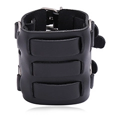 Macro shot of black punk leather wristband featuring triple layered straps and metal buckles