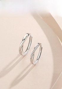 Detail of S925 sterling silver Mobius rings featuring a twisted design with pavé stones