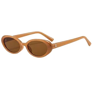 Vintage oval small frame sunglasses in amber brown with dark brown protective lenses
