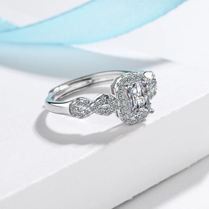Elegant silver ring with rectangular zircon center stone and pavé-set intertwined band