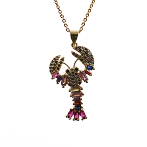 Detailed view of lobster pendant with multicolored crystals on a gold chain necklace