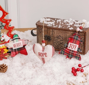 Three Christmas plush ornaments featuring Merry, Hope, and Joy on a snowy backdrop