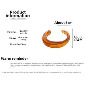 Detailed specs of amber acrylic bangle showing 28.6g weight and marble pattern texture