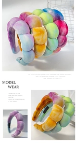 Detail of colorful tie-dye velvet sponge headband with soft texture and vibrant gradient