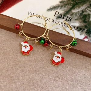 Christmas hoop earrings with Santa Claus pendants and colorful bells on gold rings