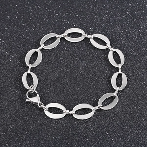 Detailed view of silver oval link chain bracelet with a secure lobster claw clasp