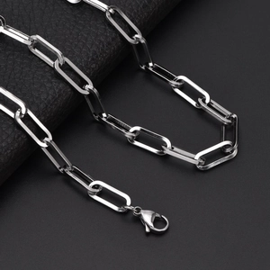 Sleek silver stainless steel 7mm rectangular paperclip chain link necklace on leather background