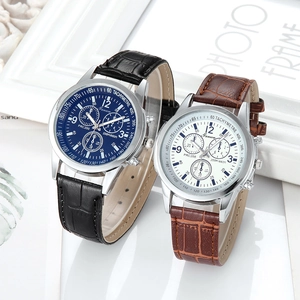 Detail view of quartz chronographs with blue and white dials on leather straps