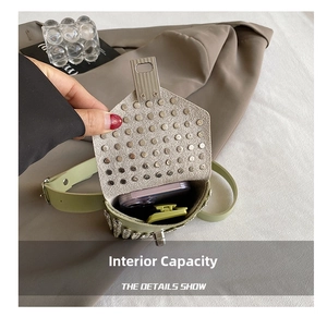 Detail view of mini green rhinestone waist bag showing internal capacity for a smartphone