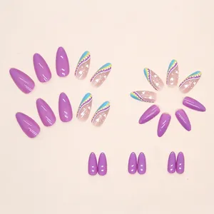 Colorful almond press-on nails with purple gloss, blue ripples, and white heart patterns