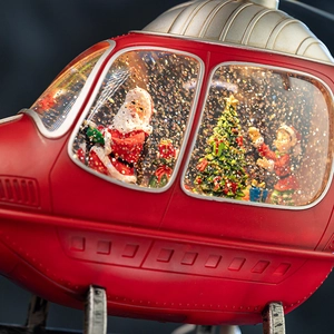 Christmas helicopter snow globe music box with Santa, elf, and glittering gold flakes