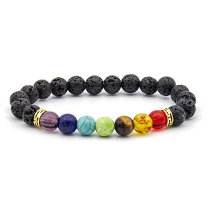 Close-up of natural lava rock beads and colorful seven chakra stones with gold metal spacers