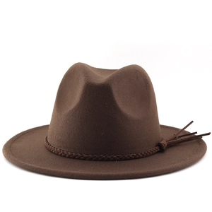 Close-up of brown fedora hat with braided leather band and tassel detail in retro style