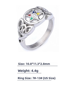 Macro shot of silver warrior ring with colorful enamel star and celtic knot details