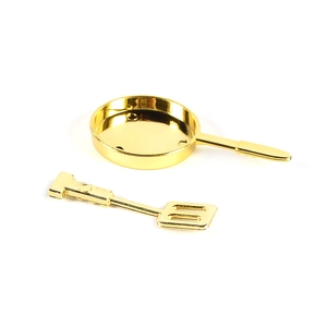Miniature gold metal kitchenware set featuring a frying pan and spatula toy model