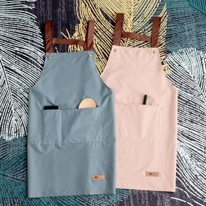 Waterproof aprons in grey-blue and pink colors with brown PU leather straps and dual pockets