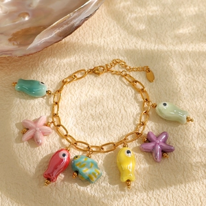 Golden ocean theme stainless steel bracelet with colorful ceramic fish and starfish charms