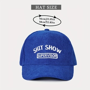 Close-up of blue corduroy baseball cap with Shit Show Supervisor white embroidery