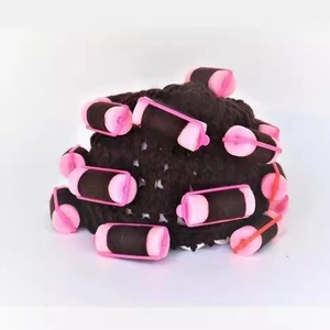 Detailed view of pink sponge hair rollers on a dark brown synthetic wig for styling