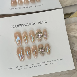 Handmade light nude pink gradient press-on nails with holographic glitter and pink heart crystal
