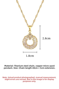Macro shot of gold clover pendant with cubic zirconia inlay and 45cm steel chain