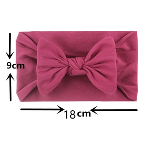 Detail showing high-elastic nylon baby headband dimensions of 18cm width and 9cm height