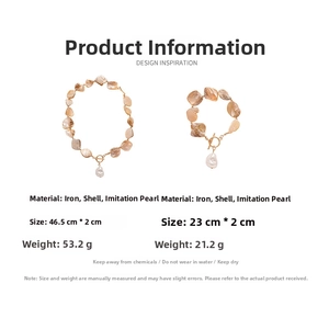 Detail view of shell and pearl necklace set with gold OT toggle clasp on white background