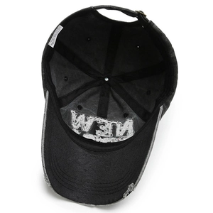 Distressed black denim baseball cap with vintage frayed edges and metal buckle strap