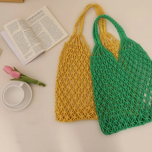 Handmade woven cotton rope tote bags in yellow and green for summer beach vacations