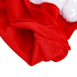 Christmas red knit gift bag with white plush pom-pom and high-quality stitched texture