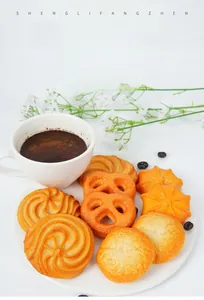 Realistic PVC artificial cookie set with pretzel and biscuit models on a white plate