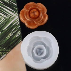 Detail of rose silicone mold with a shimmering bronze-finished floral wax craft piece