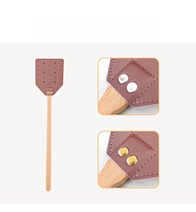 Detail of durable brass rivets connecting the wooden handle and the leather fly swatter