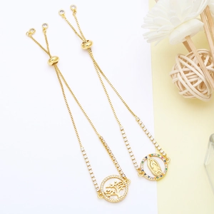 Detail of adjustable gold bracelets with Virgin Mary relief and Tree of Life cubic zirconia