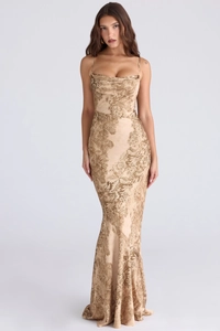 Detailed view of elegant gold floral jacquard texture on bodycon fishtail maxi dress