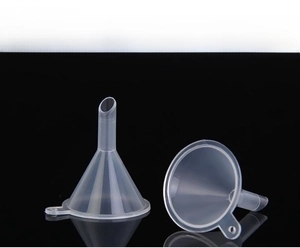 Macro detail of transparent plastic mini funnels with narrow tubes and hanging holes