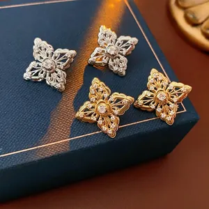 Exquisite hollow flower stud earrings in gold and silver with shimmering pavé zircon