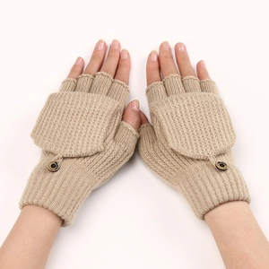 Detail of khaki knitted fingerless gloves showing striped texture and flip top button
