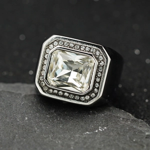 Macro shot of 316 stainless steel ring with large rectangular zircon and pave diamonds