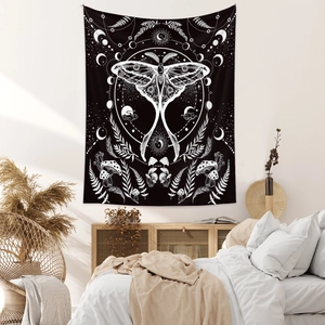 Detail of moth tapestry with moon phases and mushrooms in a cozy bedroom setting