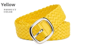 Close-up of bright yellow woven PU leather dress belt with polished silver buckle detail