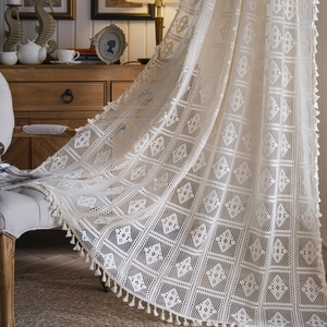 Beige floral lace curtain with hollow crochet patterns and tassel fringe decor