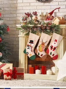 Cozy fireplace setting with snowman, reindeer and Santa Christmas stockings hanging