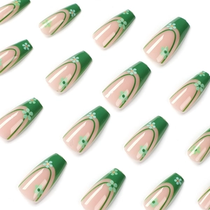 Long coffin press-on nails with green French tips and delicate daisy floral patterns